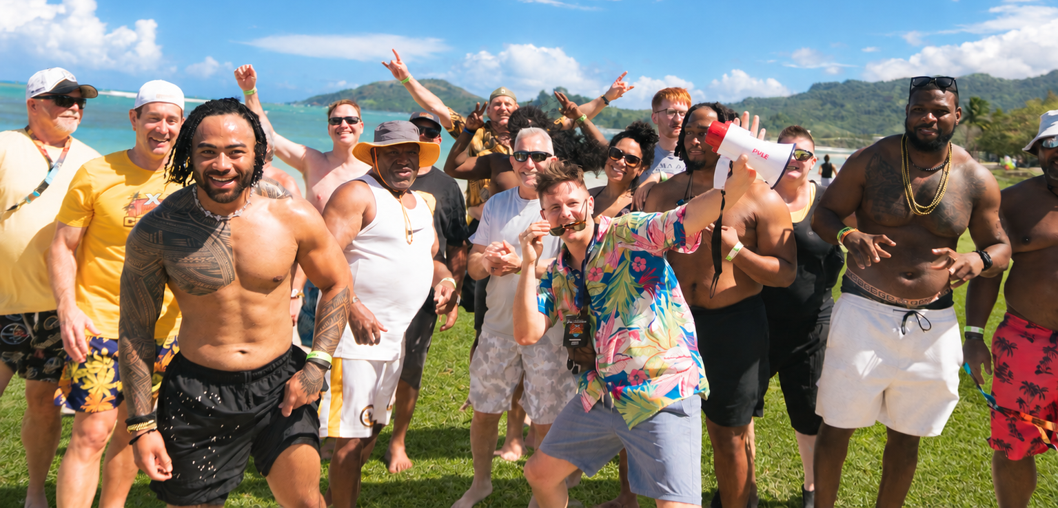 Legends and fans celebrating together on the beach